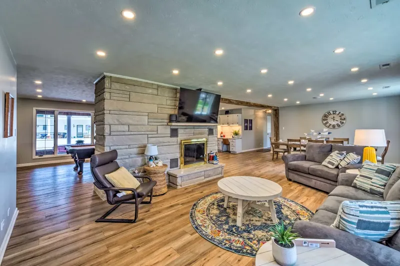 Living room with stone fireplace